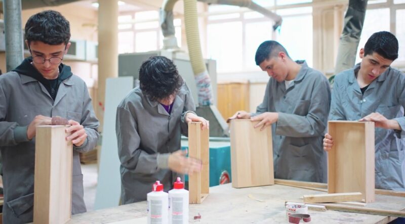 Four students doing a woodwork